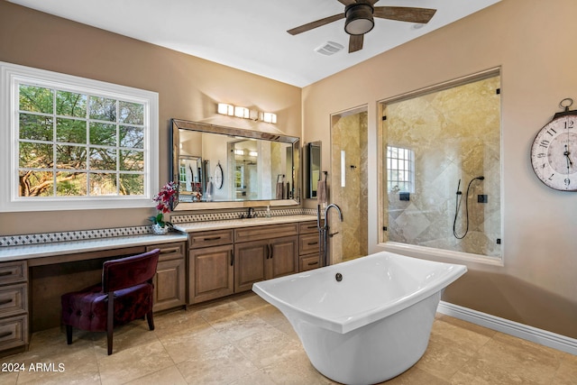 bathroom featuring ceiling fan, a tile shower, vanity, visible vents, and a soaking tub