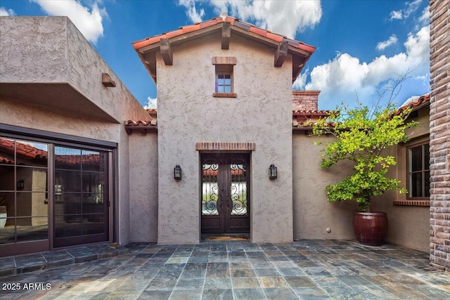 37440 N 104th Pl, Scottsdale, AZ 85262 - property entrance with stucco siding, french doors, and a tile roof