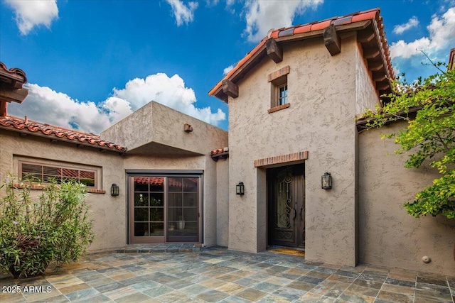 37440 N 104th Pl, Scottsdale, AZ 85262 - property entrance featuring stucco siding, a patio, and a tiled roof