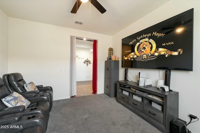 living room with ceiling fan and carpet flooring