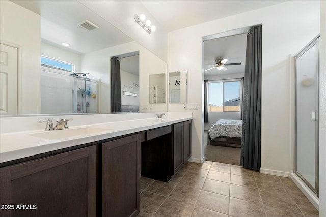 bathroom featuring vanity, tile patterned floors, a shower with door, and ceiling fan