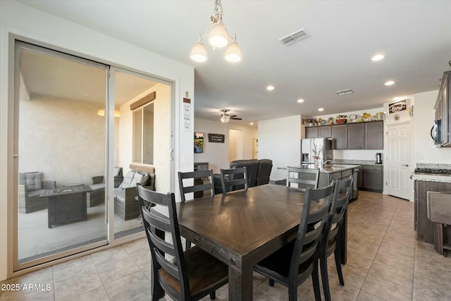 dining room with ceiling fan and light tile patterned floors