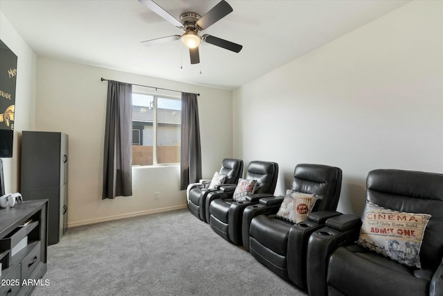 cinema with ceiling fan and light colored carpet