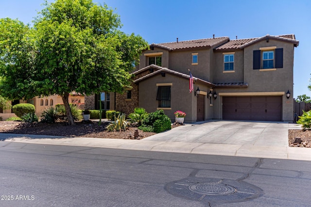 19427 W Colter St, Litchfield Park, AZ 85340 - mediterranean / spanish-style house with a tile roof, stucco siding, concrete driveway, and a garage