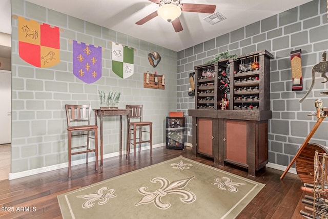 19427 W Colter St, Litchfield Park, AZ 85340 - wine room with ceiling fan, hardwood / wood-style flooring, tile walls, and baseboards