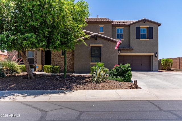 19427 W Colter St, Litchfield Park, AZ 85340 - view of front of property featuring a tiled roof, concrete driveway, a garage, and stucco siding
