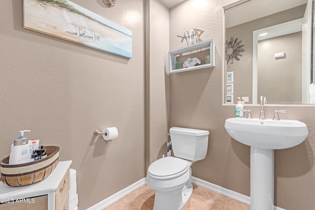 19427 W Colter St, Litchfield Park, AZ 85340 - bathroom with toilet, tile patterned flooring, and baseboards