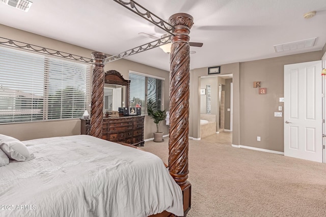 19427 W Colter St, Litchfield Park, AZ 85340 - carpeted bedroom with baseboards, ceiling fan, and ensuite bathroom