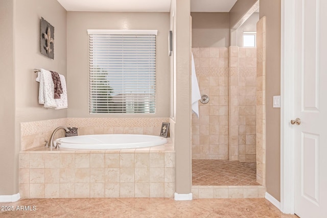 19427 W Colter St, Litchfield Park, AZ 85340 - bathroom featuring a garden tub, a tile shower, and tile patterned floors