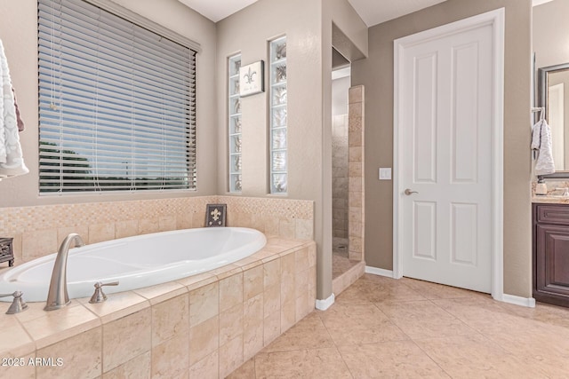 19427 W Colter St, Litchfield Park, AZ 85340 - full bathroom with a bath, tiled shower, tile patterned floors, and plenty of natural light