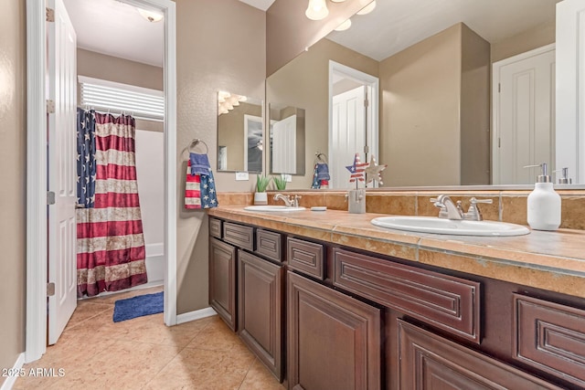 19427 W Colter St, Litchfield Park, AZ 85340 - full bath featuring double vanity, tile patterned flooring, and shower / bathtub combination with curtain