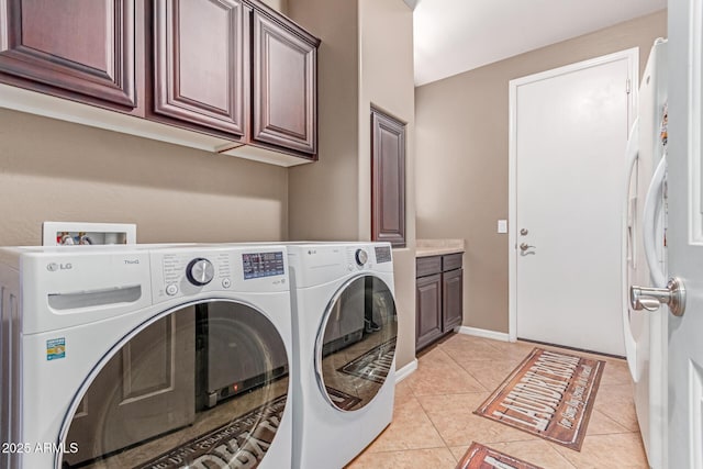 19427 W Colter St, Litchfield Park, AZ 85340 - washroom with cabinet space, independent washer and dryer, and light tile patterned flooring