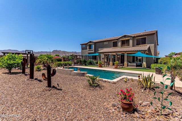19427 W Colter St, Litchfield Park, AZ 85340 - swimming pool with outdoor lounge area, a mountain view, a patio area, and a pergola