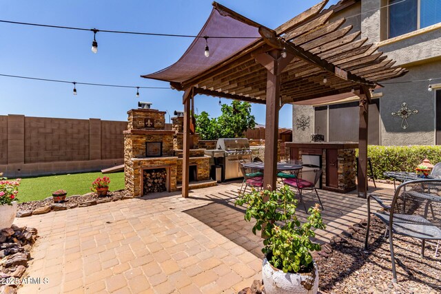 19427 W Colter St, Litchfield Park, AZ 85340 - view of patio with an outdoor stone fireplace and a pergola