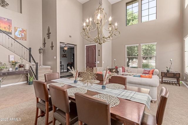 19427 W Colter St, Litchfield Park, AZ 85340 - dining room with a towering ceiling, carpet floors, baseboards, and stairs
