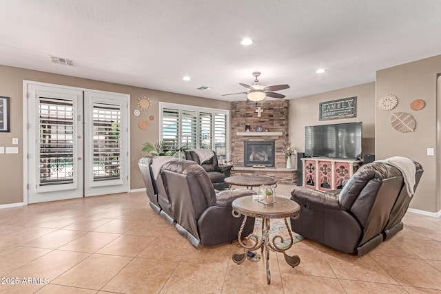 19427 W Colter St, Litchfield Park, AZ 85340 - living area featuring ceiling fan, a fireplace, recessed lighting, baseboards, and light tile patterned floors