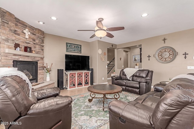 19427 W Colter St, Litchfield Park, AZ 85340 - living room with stairway, a ceiling fan, recessed lighting, and a fireplace