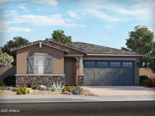 view of front facade featuring an attached garage, stone siding, decorative driveway, and stucco siding