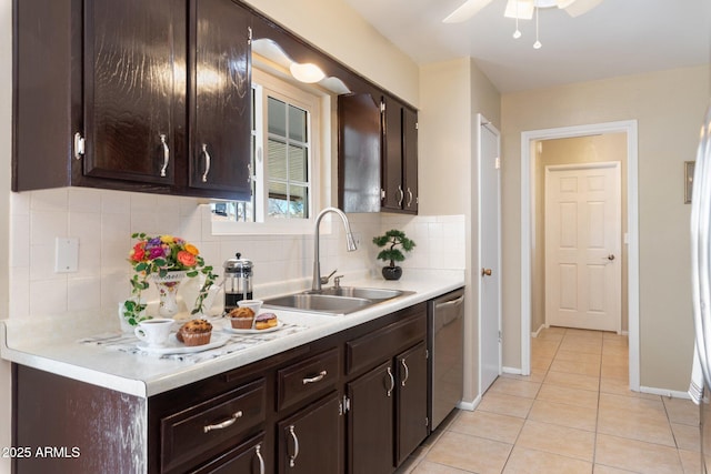 kitchen with tasteful backsplash, dishwasher, sink, light tile patterned floors, and dark brown cabinetry