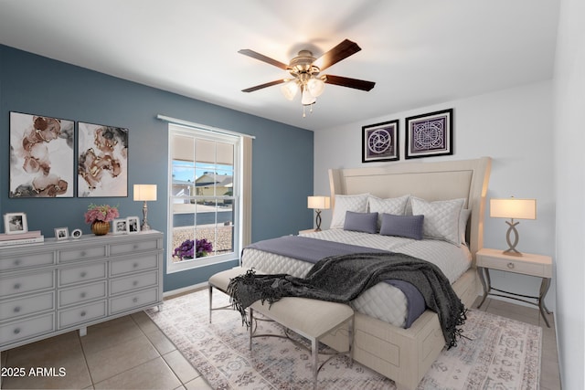 tiled bedroom with ceiling fan