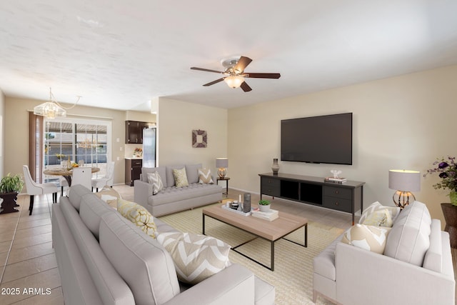 living room with ceiling fan with notable chandelier