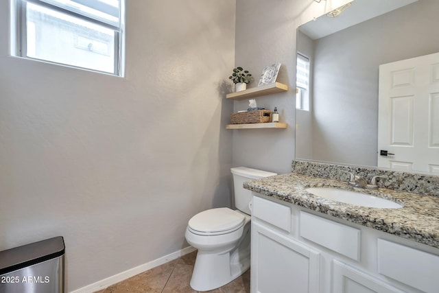 2210 W Goldmine Mountain Dr, Queen Creek, AZ 85144 - bathroom with toilet, vanity, tile patterned flooring, and a wealth of natural light