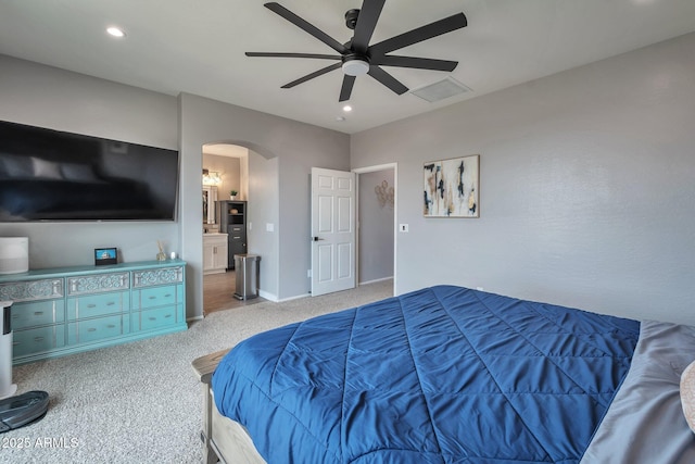2210 W Goldmine Mountain Dr, Queen Creek, AZ 85144 - bedroom with arched walkways, visible vents, recessed lighting, carpet flooring, and baseboards