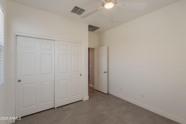 2680 E Daniel Dr, Gilbert, AZ 85298 - unfurnished bedroom featuring a closet, wood finished floors, and a ceiling fan