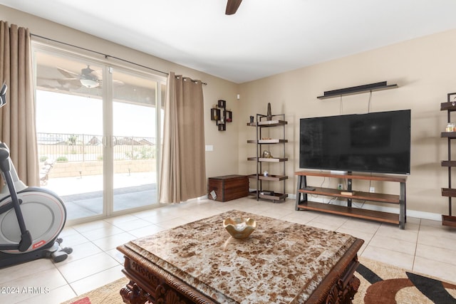 living room featuring light tile patterned floors and ceiling fan