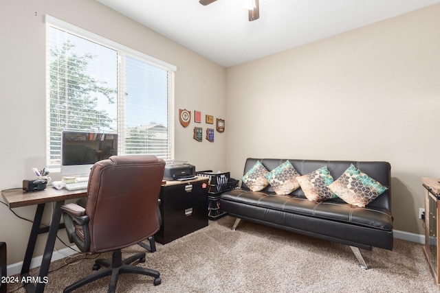 office space featuring carpet floors, a wealth of natural light, and ceiling fan