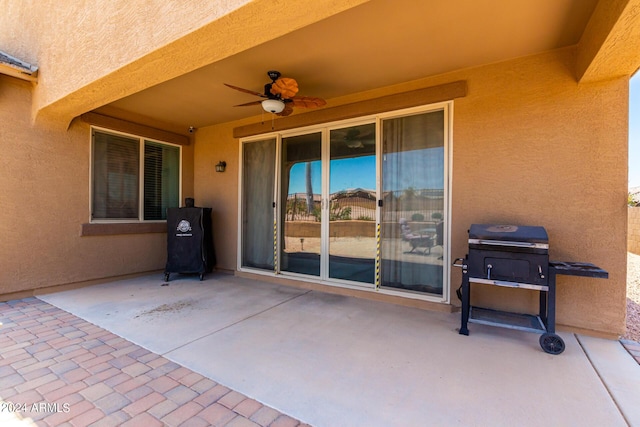 view of patio / terrace with ceiling fan and area for grilling