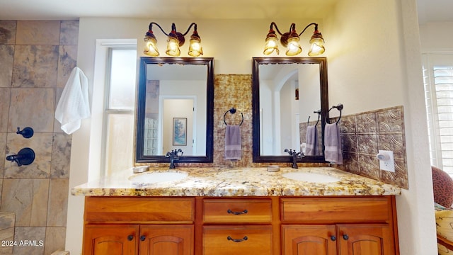 bathroom with vanity and backsplash