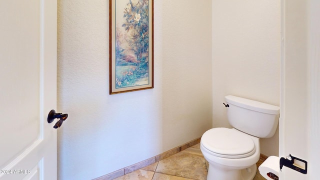 bathroom featuring tile patterned flooring and toilet