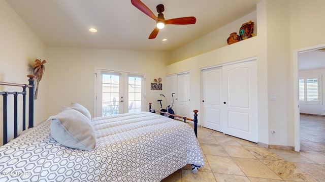 bedroom with multiple windows, ceiling fan, french doors, and vaulted ceiling