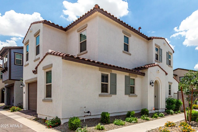 9901 E Tamery Ave, Mesa, AZ 85212 - mediterranean / spanish-style home featuring a tiled roof, stucco siding, and an attached garage