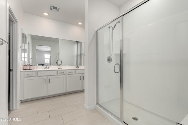 9901 E Tamery Ave, Mesa, AZ 85212 - full bathroom featuring a stall shower, double vanity, recessed lighting, and tile patterned flooring