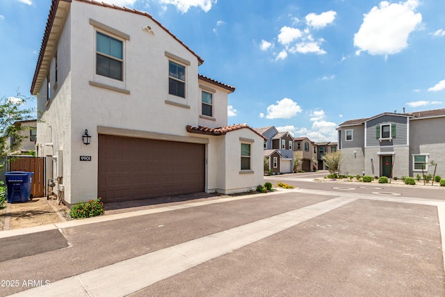 9901 E Tamery Ave, Mesa, AZ 85212 - view of front of home with a tiled roof, stucco siding, a residential view, and a garage