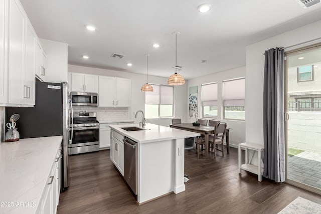 9901 E Tamery Ave, Mesa, AZ 85212 - kitchen with stainless steel appliances, a sink, dark wood finished floors, backsplash, and recessed lighting