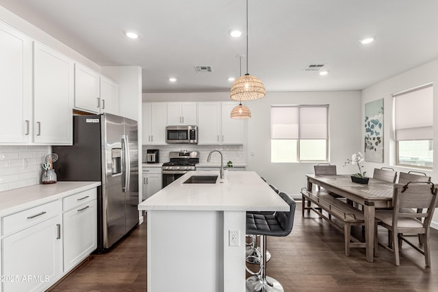 9901 E Tamery Ave, Mesa, AZ 85212 - kitchen featuring appliances with stainless steel finishes, a sink, healthy amount of natural light, tasteful backsplash, and recessed lighting