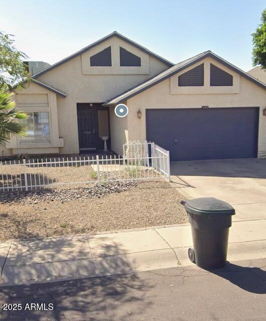 1122 N 87th St, Scottsdale, AZ 85257 - view of front facade featuring concrete driveway, a fenced front yard, a garage, and stucco siding