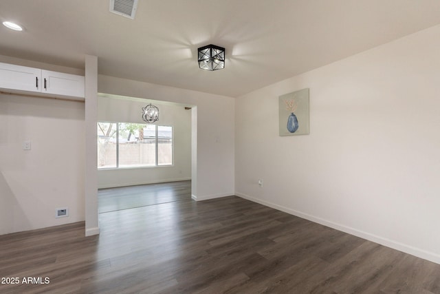 3620 E Ludlow Dr, Phoenix, AZ 85032 - unfurnished room featuring dark wood-style flooring, baseboards, recessed lighting, and a chandelier