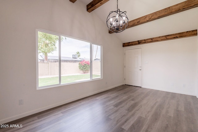3620 E Ludlow Dr, Phoenix, AZ 85032 - spare room featuring a chandelier, wood finished floors, and baseboards