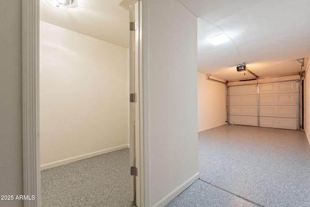 3620 E Ludlow Dr, Phoenix, AZ 85032 - garage featuring baseboards and a garage door opener