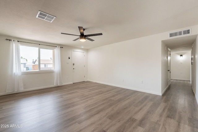 3620 E Ludlow Dr, Phoenix, AZ 85032 - empty room featuring a ceiling fan, wood finished floors, and baseboards