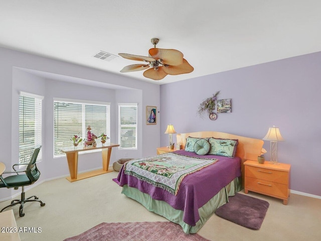 carpeted bedroom with ceiling fan