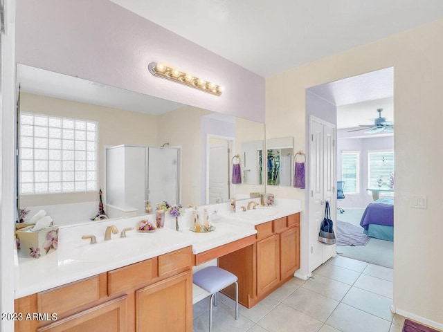 bathroom with breakfast area, separate shower and tub, tile patterned floors, vanity, and ceiling fan