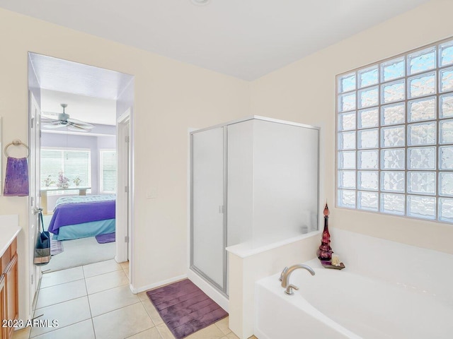 bathroom with vanity, independent shower and bath, ceiling fan, and tile patterned flooring