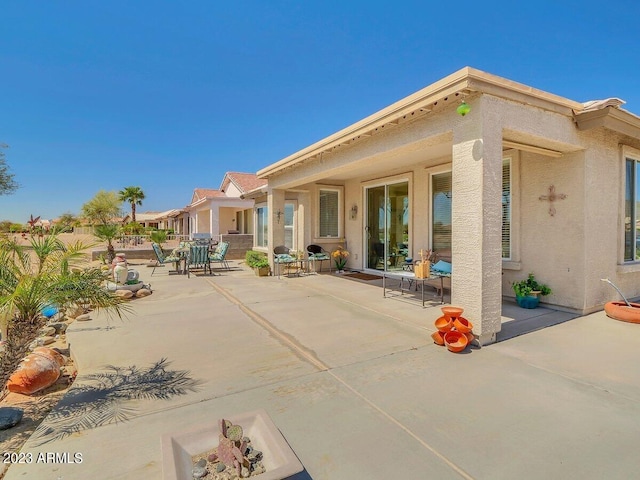 back of house featuring a patio area