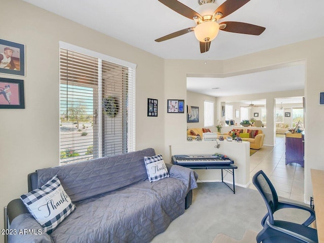 carpeted living room featuring ceiling fan