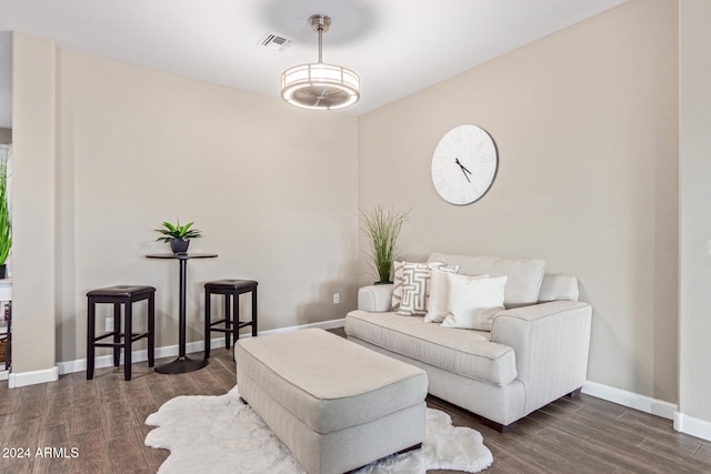 living room with dark hardwood / wood-style flooring